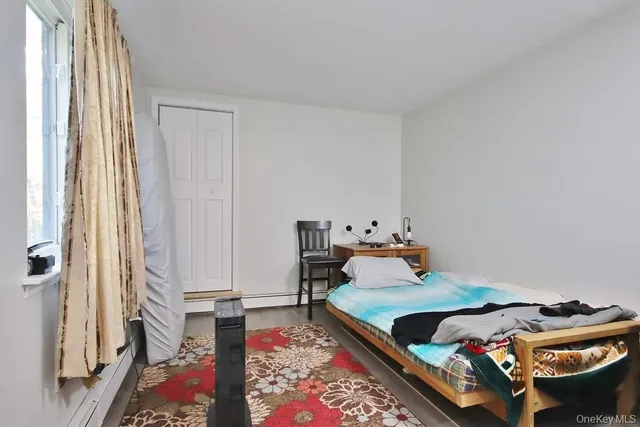 a bed room with bed and a window