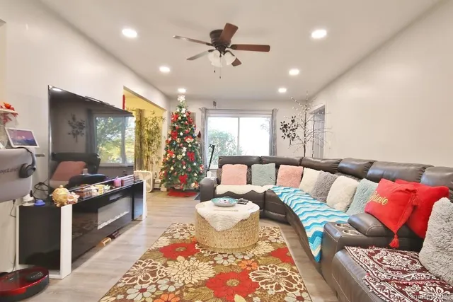 a living room with furniture and a flat screen tv