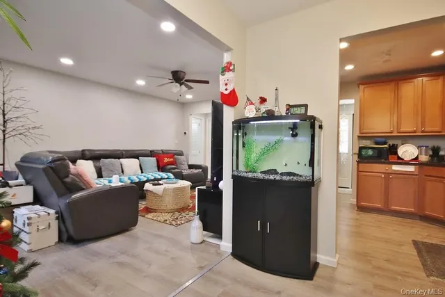 a living room with furniture and a kitchen