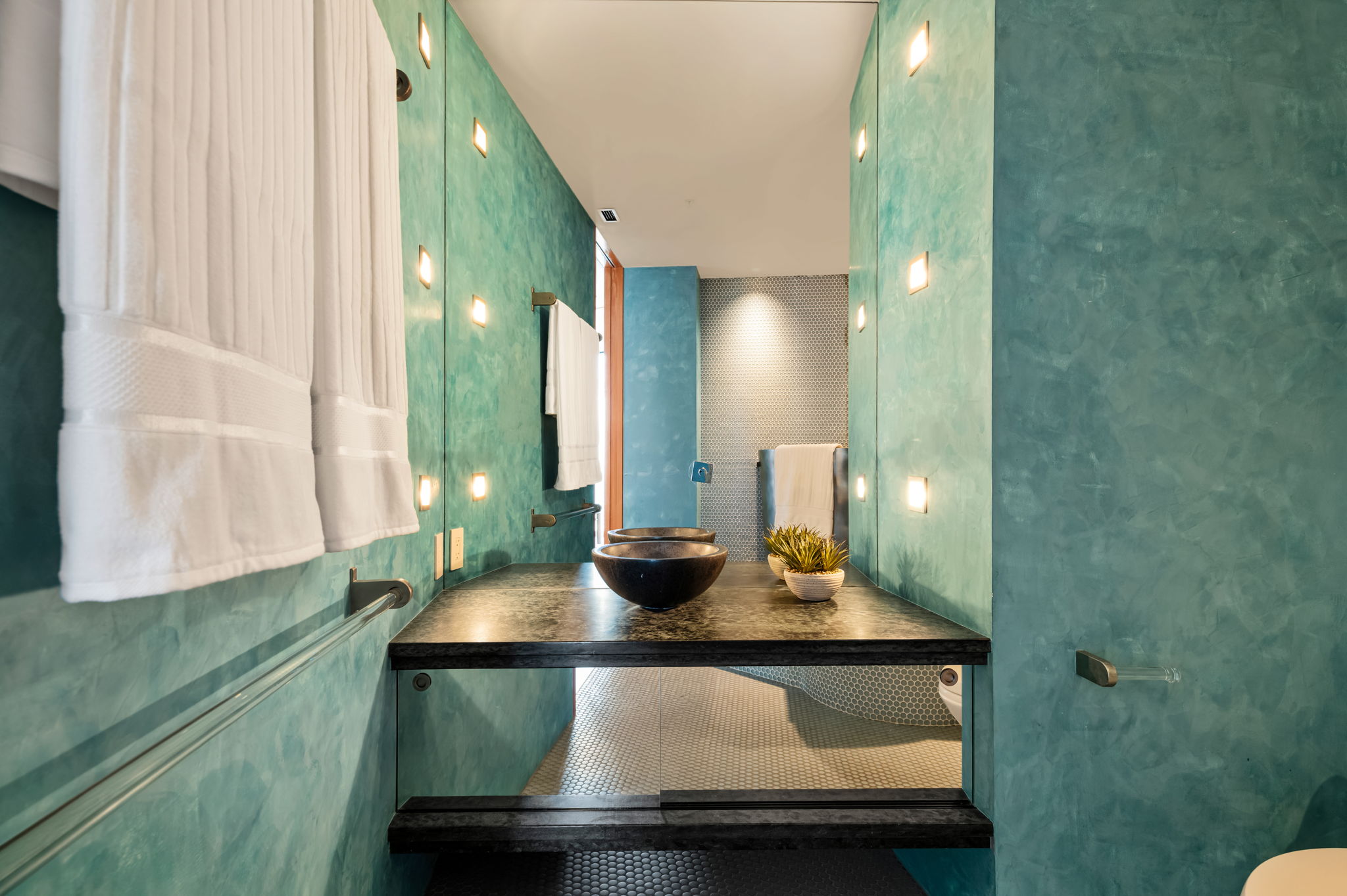 360 Nueces Street, Unit 4211 Austin, TX 78701 - Photo 37 of 40 a bathroom with a sink and a mirror