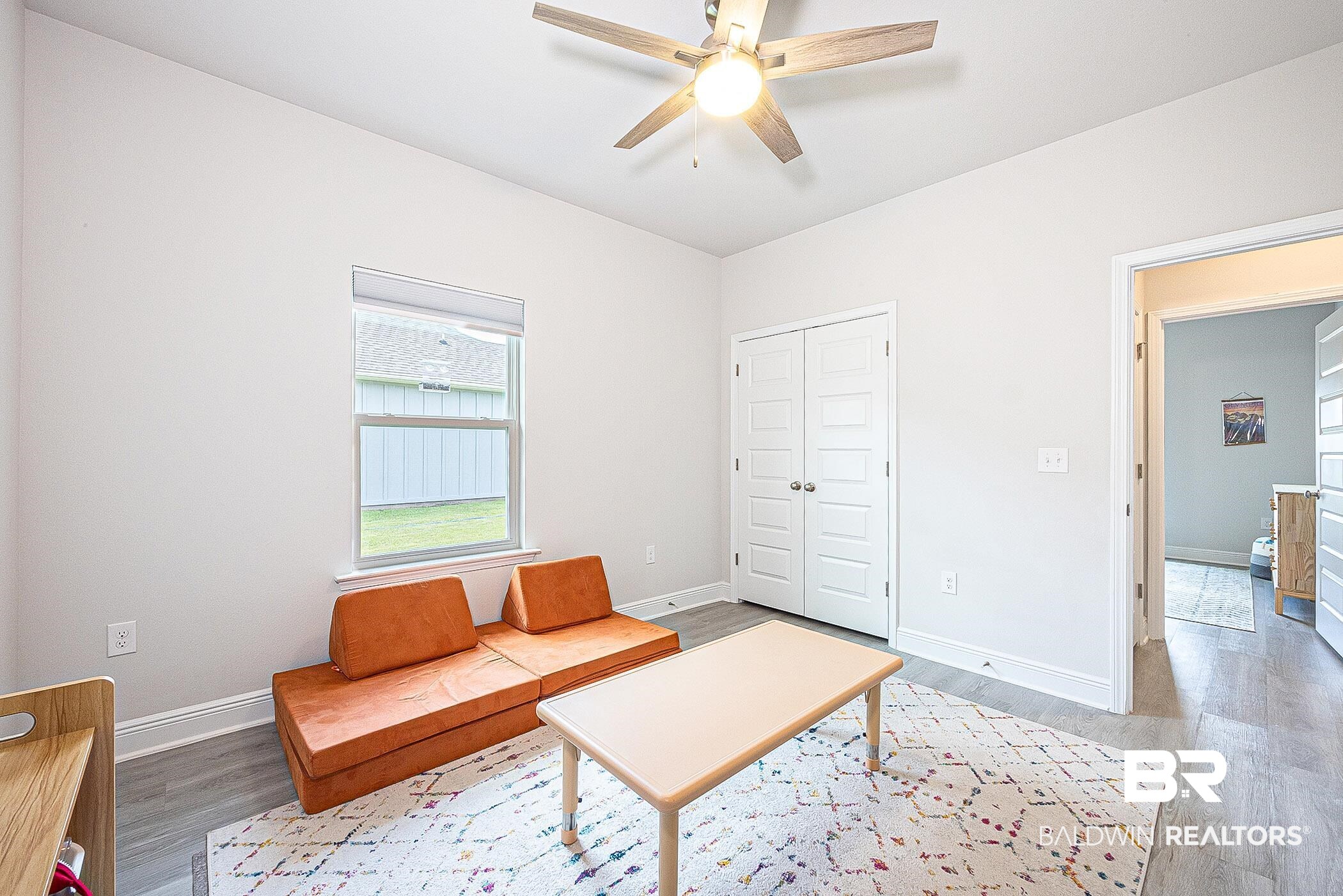 11044 Native Dancer Way Daphne, AL 36526 - Photo 27 of 67 Living room featuring ceiling fan and hardwood / wood-style flooring