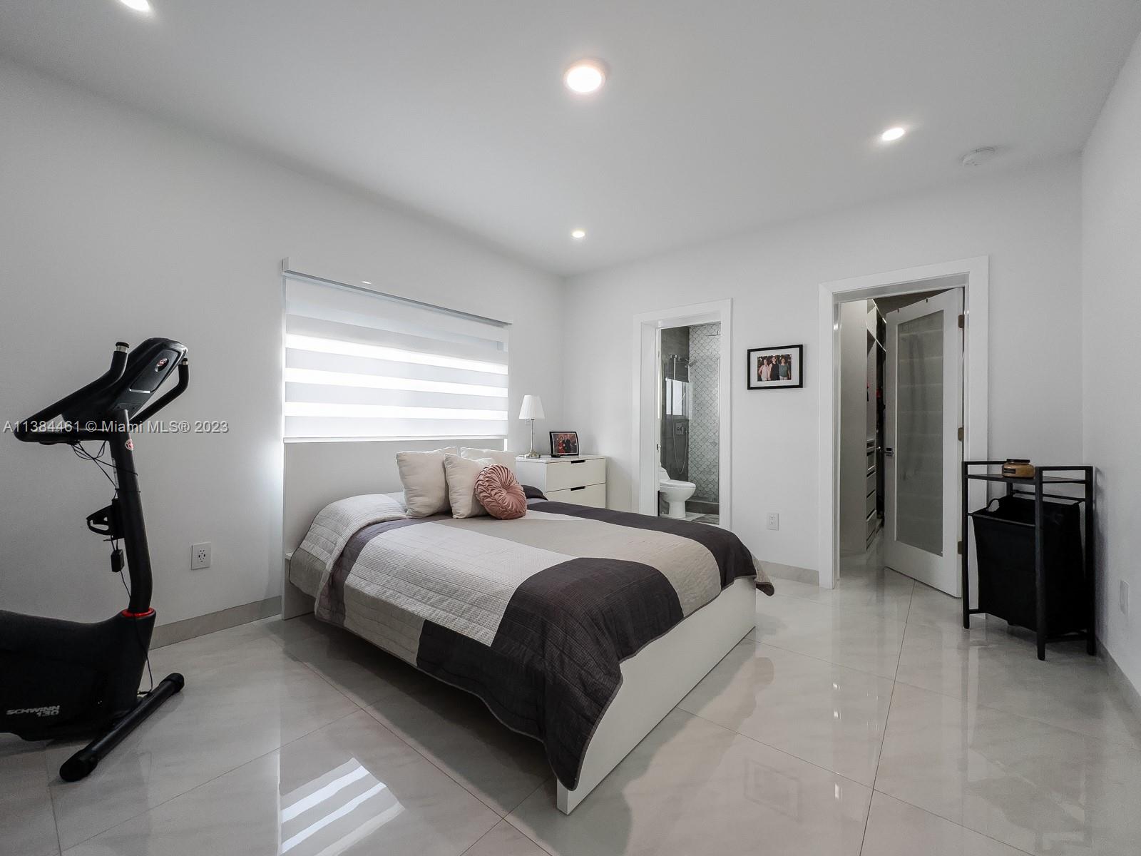 420 Southwest 18th Road Miami, FL 33129 - Photo 18 of 30 a bedroom with double bed and a window