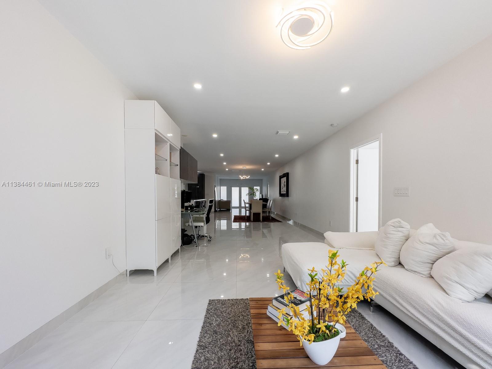 420 Southwest 18th Road Miami, FL 33129 - Photo 21 of 30 a living room with furniture and a wooden floor
