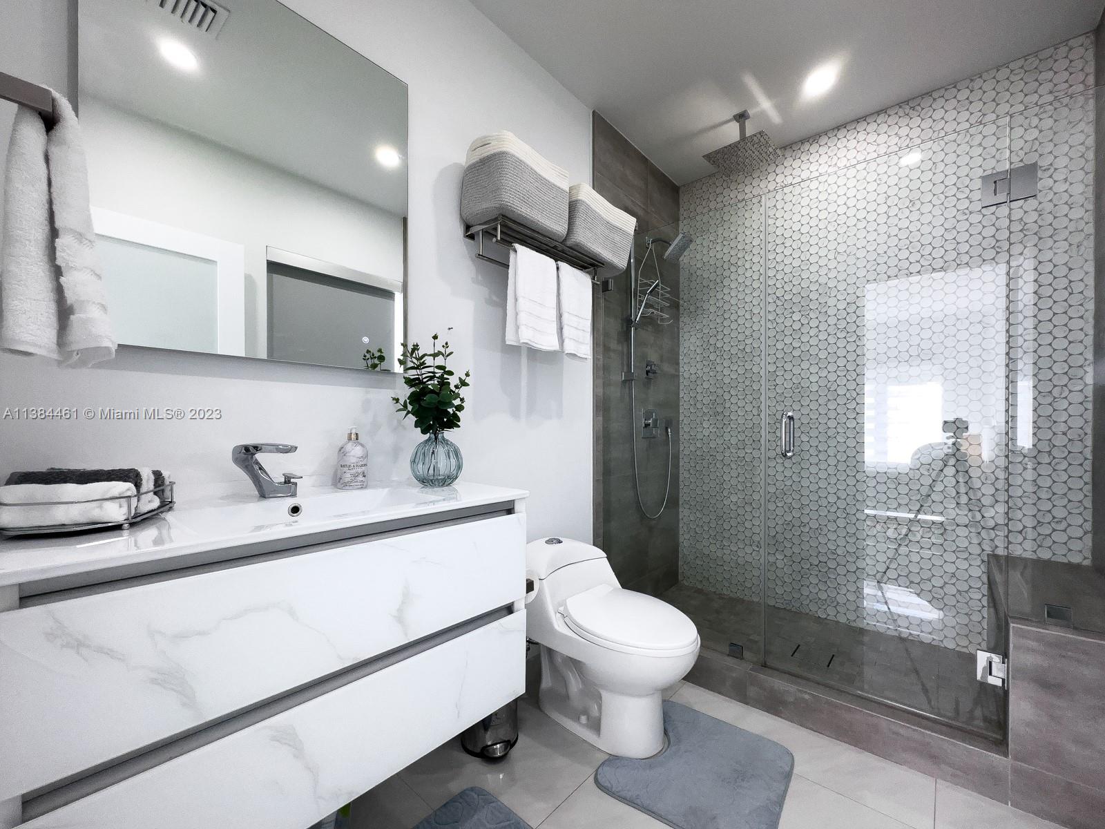 420 Southwest 18th Road Miami, FL 33129 - Photo 24 of 30 a bathroom with a sink toilet and shower