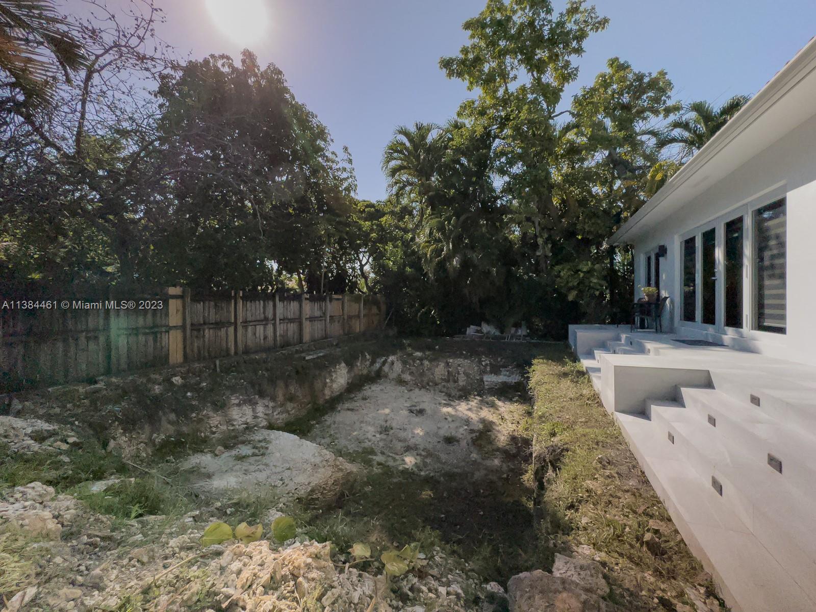 420 Southwest 18th Road Miami, FL 33129 - Photo 28 of 30 a backyard of a house with lots of green space