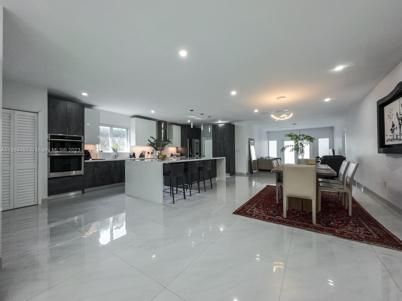 420 Southwest 18th Road Miami, FL 33129 - Photo 8 of 30 a kitchen with a table and chairs