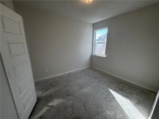 a view of an empty room and window