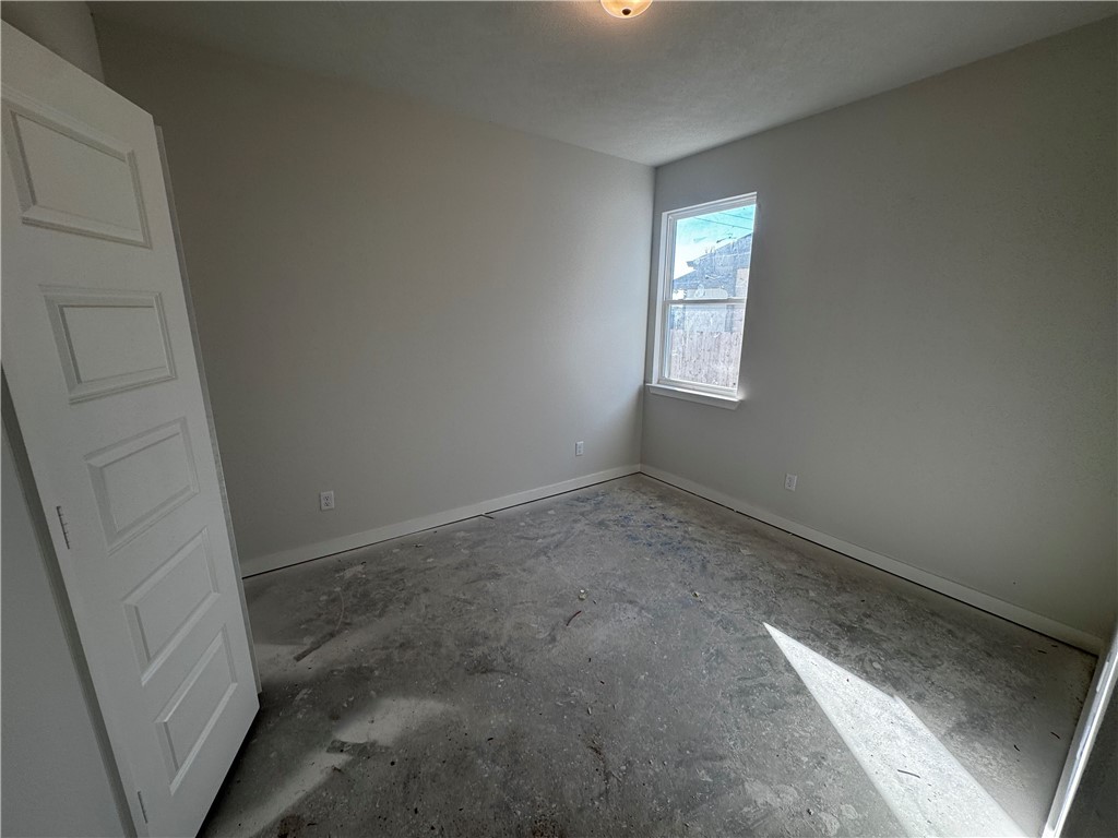 4756 Holm Oak Road Bryan, TX 77845 - Photo 12 of 13 a view of an empty room and window