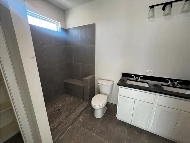 a bathroom with a toilet and a sink
