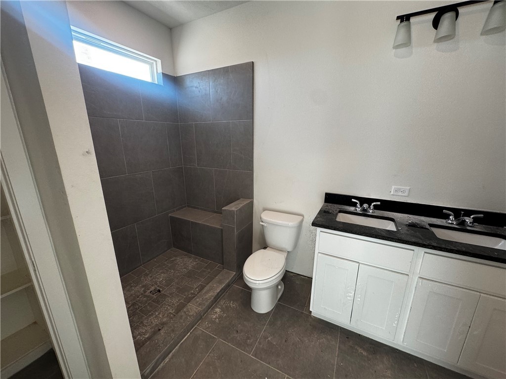 4756 Holm Oak Road Bryan, TX 77845 - Photo 8 of 13 a bathroom with a toilet and a sink