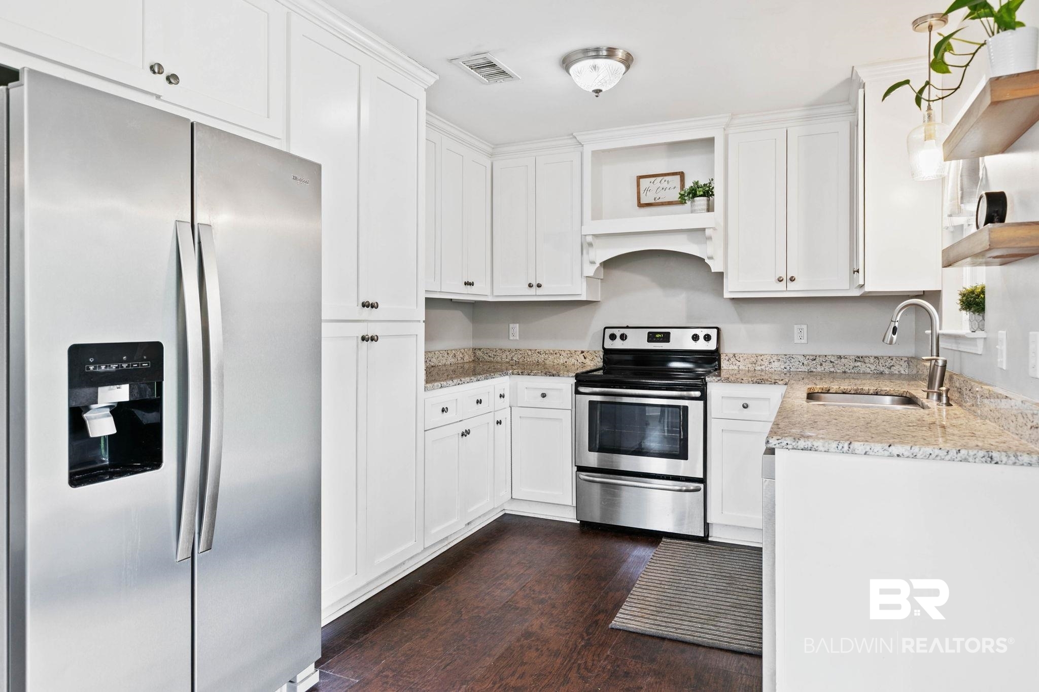 22810 High Ridge Road Fairhope, AL 36532 - Photo 26 of 78 Kitchen featuring white cabinetry with dark hardware, stainless steel appliances, granite countertops, and wood-finish flooring