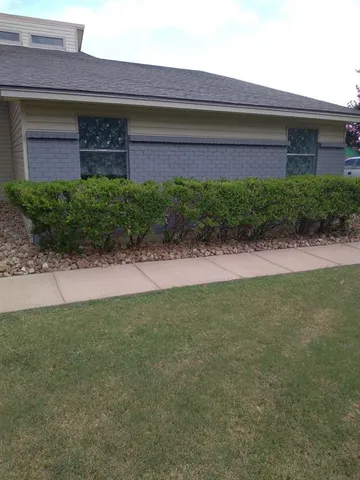 a house view with a garden space