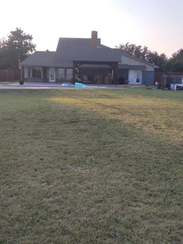 a living room with fireplace furniture and a flat screen tv