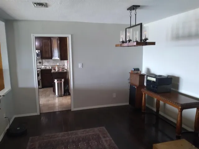 a living room with furniture and a gate