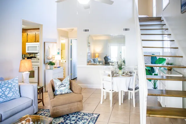 a living room with furniture and flat screen tv