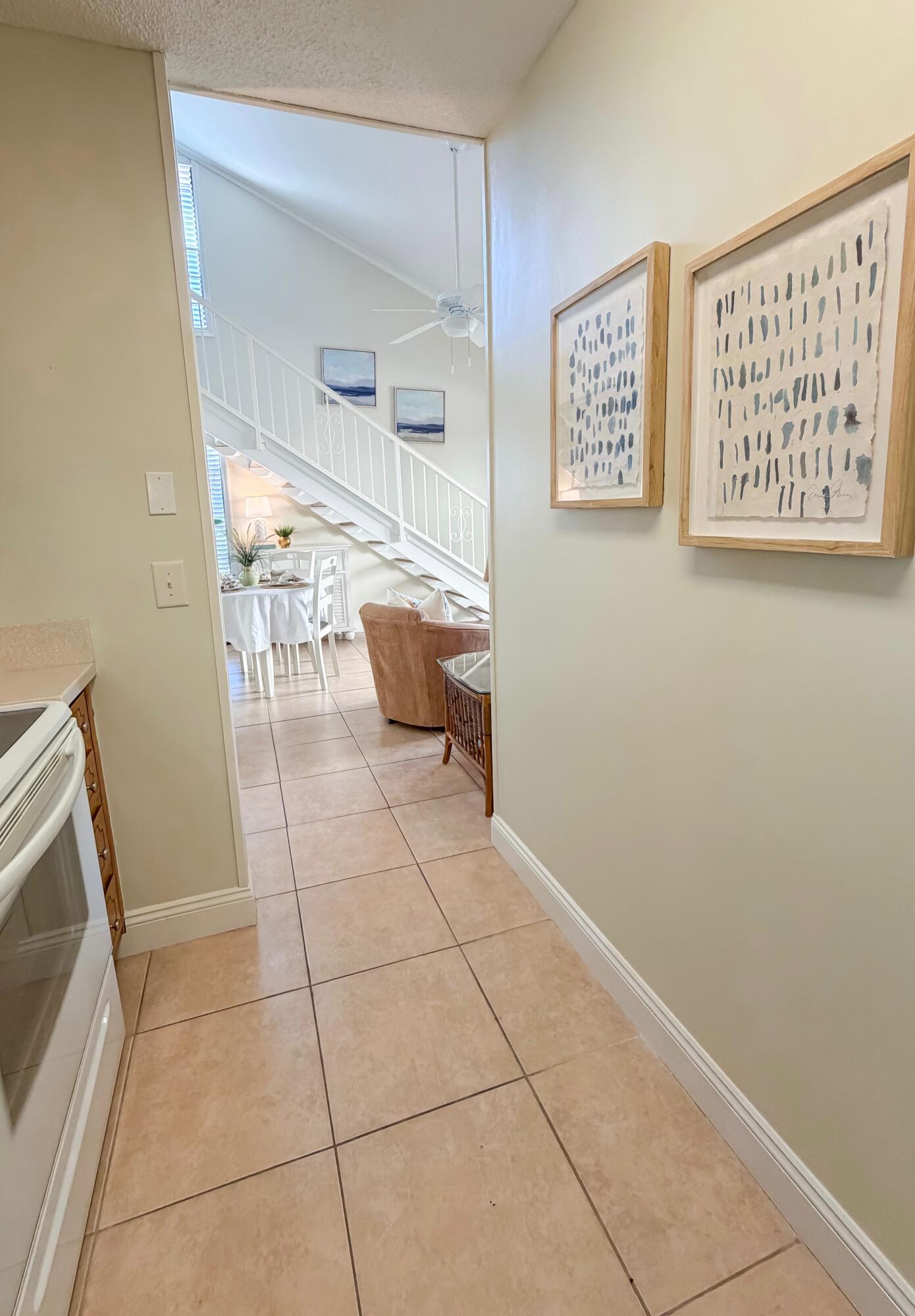 17462 Front Beach Road, Unit 38B Panama City Beach, FL 32413 - Photo 13 of 39 a living room with a couch and a stove top oven