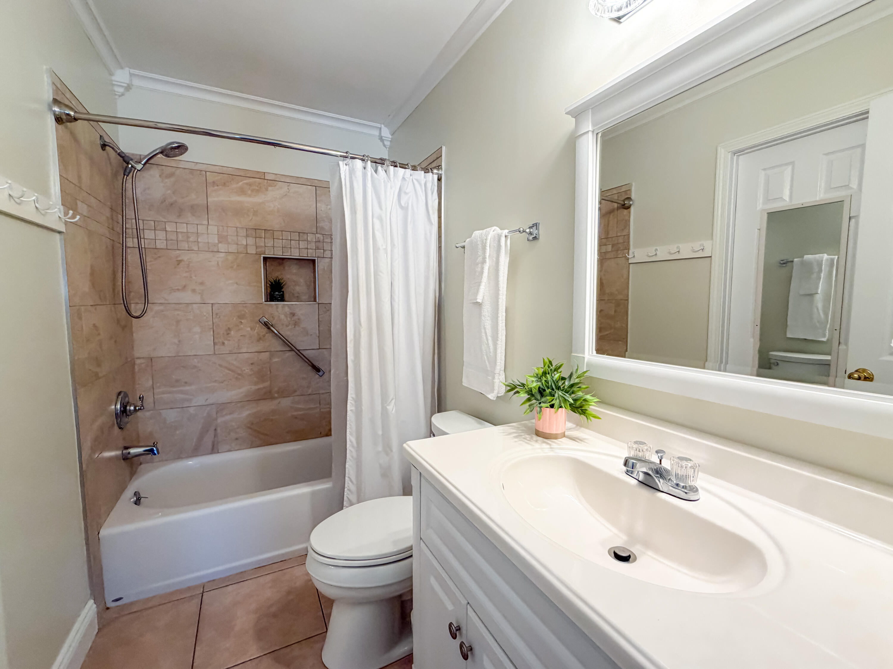 17462 Front Beach Road, Unit 38B Panama City Beach, FL 32413 - Photo 18 of 39 a bathroom with a sink toilet and shower