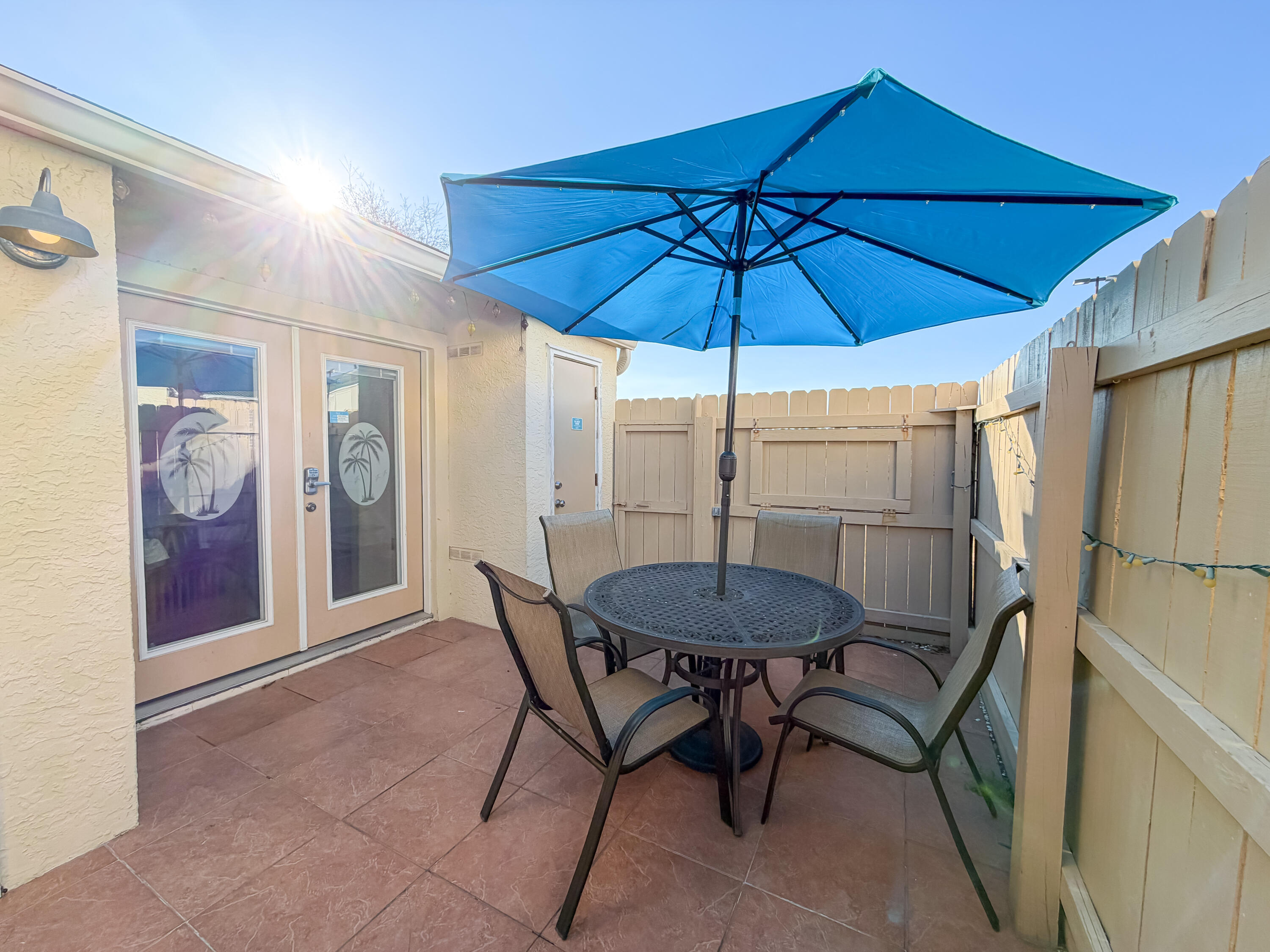 17462 Front Beach Road, Unit 38B Panama City Beach, FL 32413 - Photo 24 of 39 a table and chairs in patio