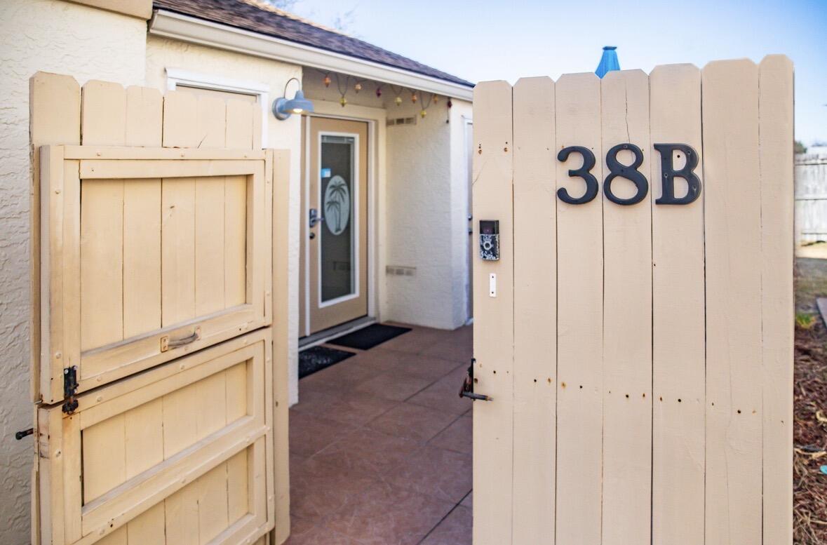 17462 Front Beach Road, Unit 38B Panama City Beach, FL 32413 - Photo 29 of 39 a view of a kitchen with a refrigerator and cabinets