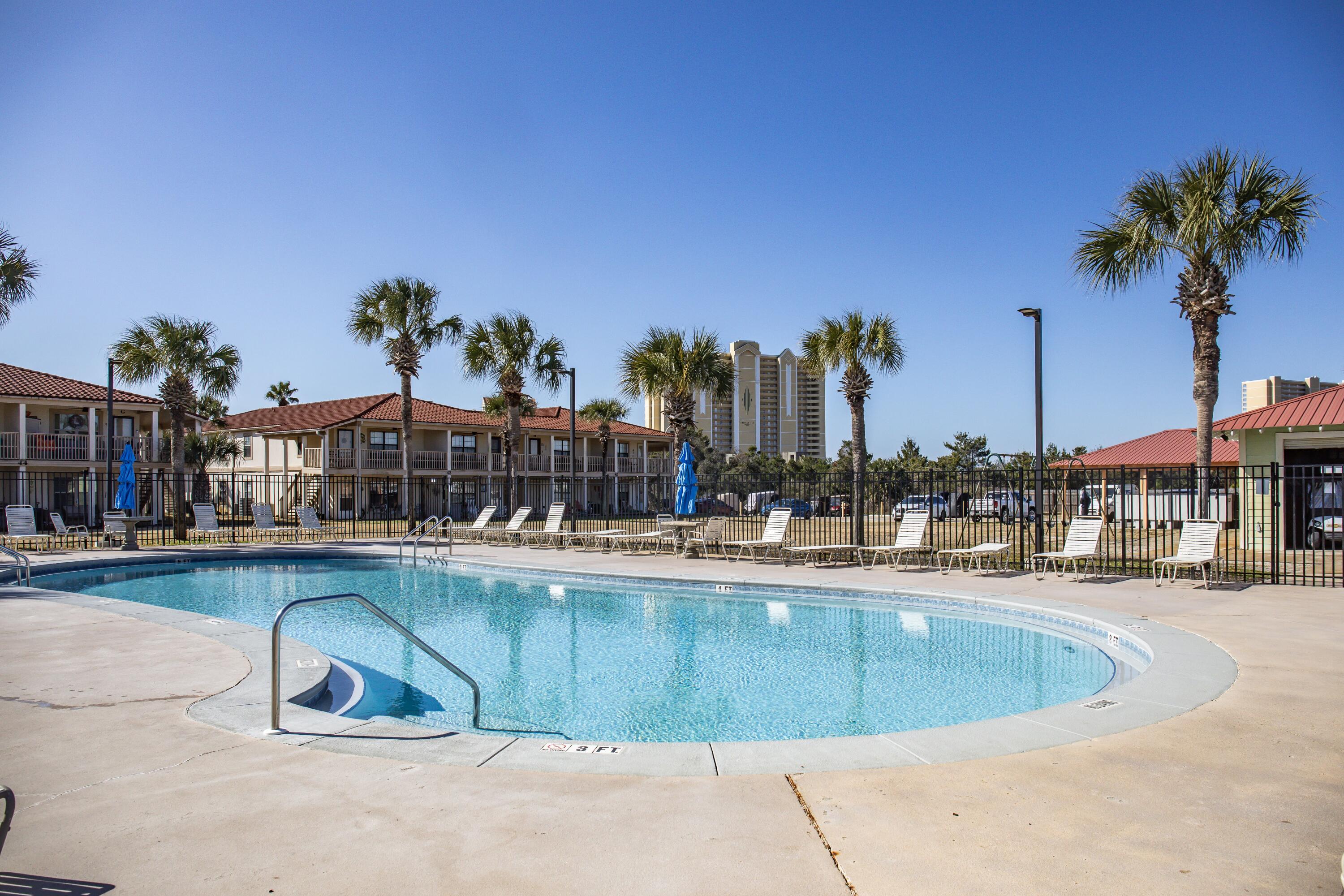17462 Front Beach Road, Unit 38B Panama City Beach, FL 32413 - Photo 31 of 39 a view of a swimming pool and a terrace