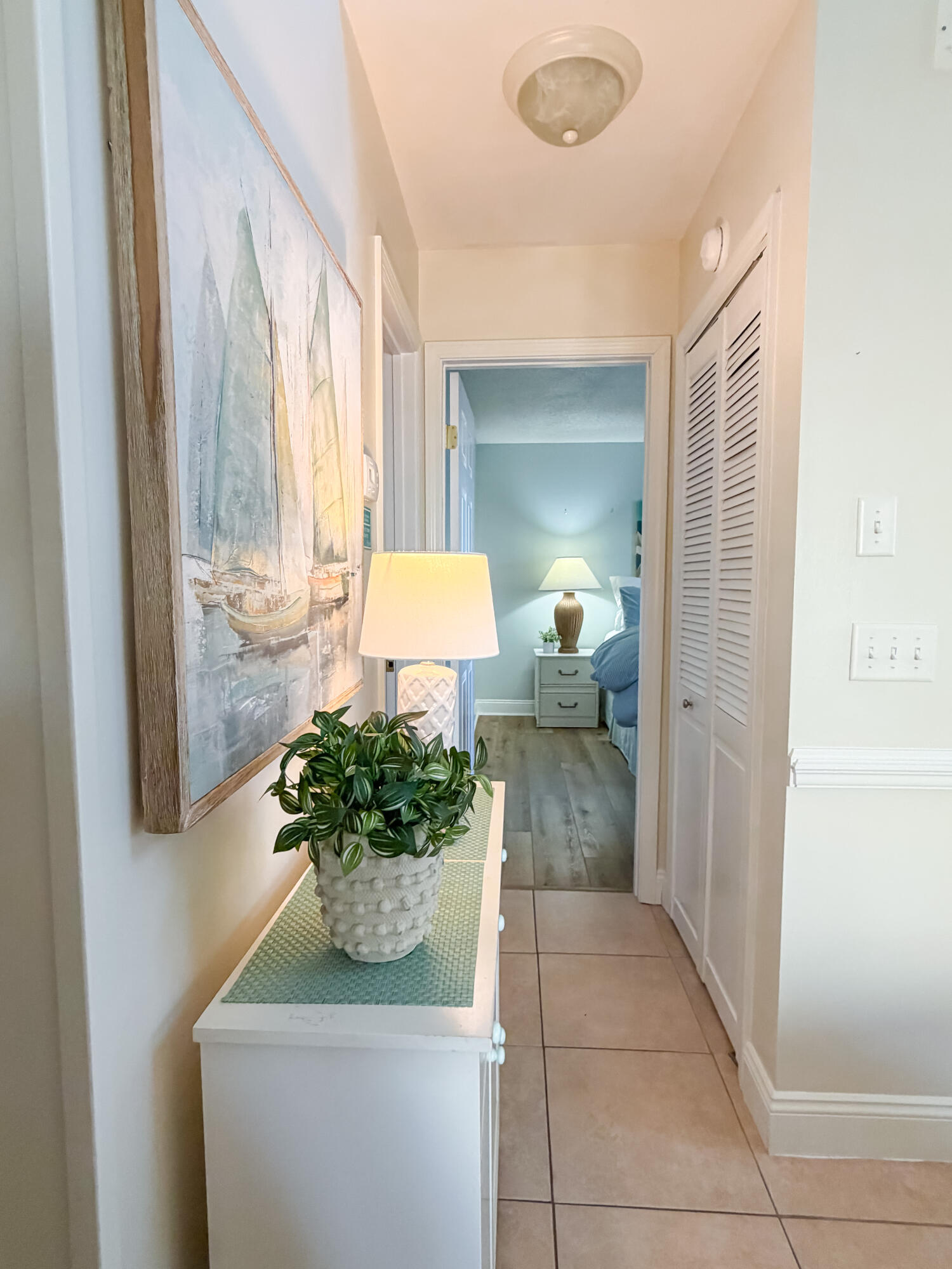 17462 Front Beach Road, Unit 38B Panama City Beach, FL 32413 - Photo 5 of 39 a living room with furniture and a potted plant