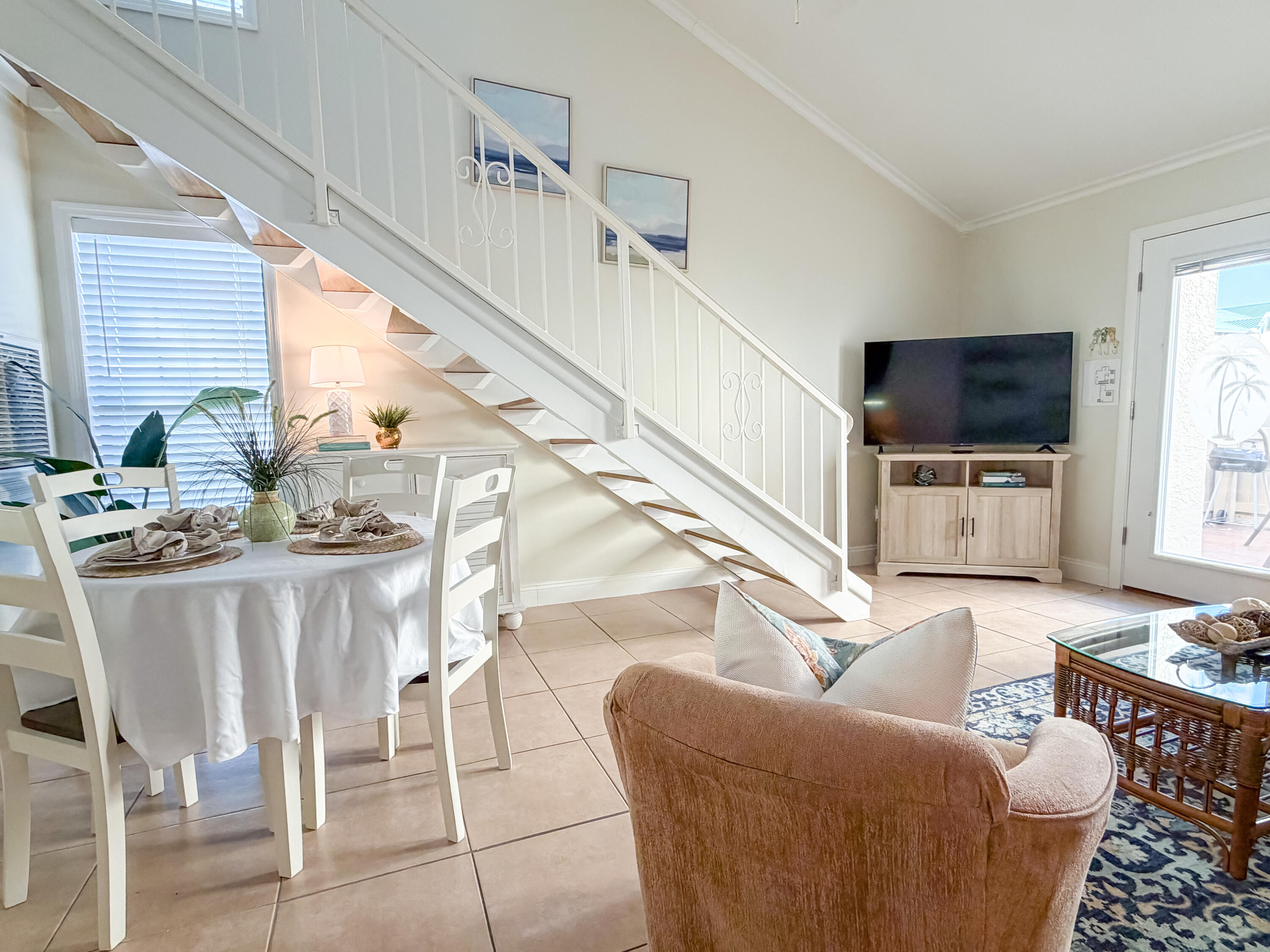 17462 Front Beach Road, Unit 38B Panama City Beach, FL 32413 - Photo 6 of 39 a living room with furniture and a flat screen tv