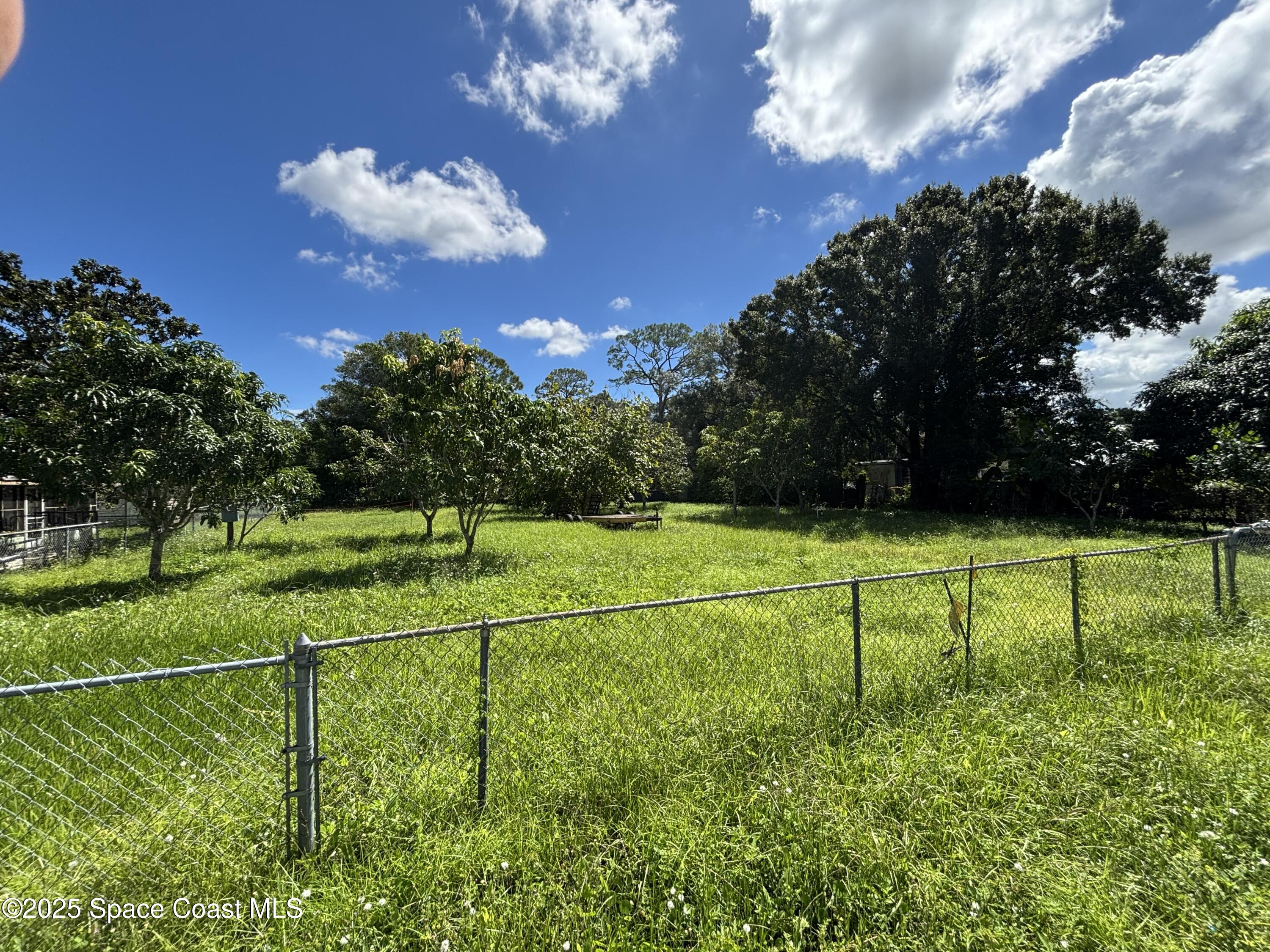 a view of a house with a big yard