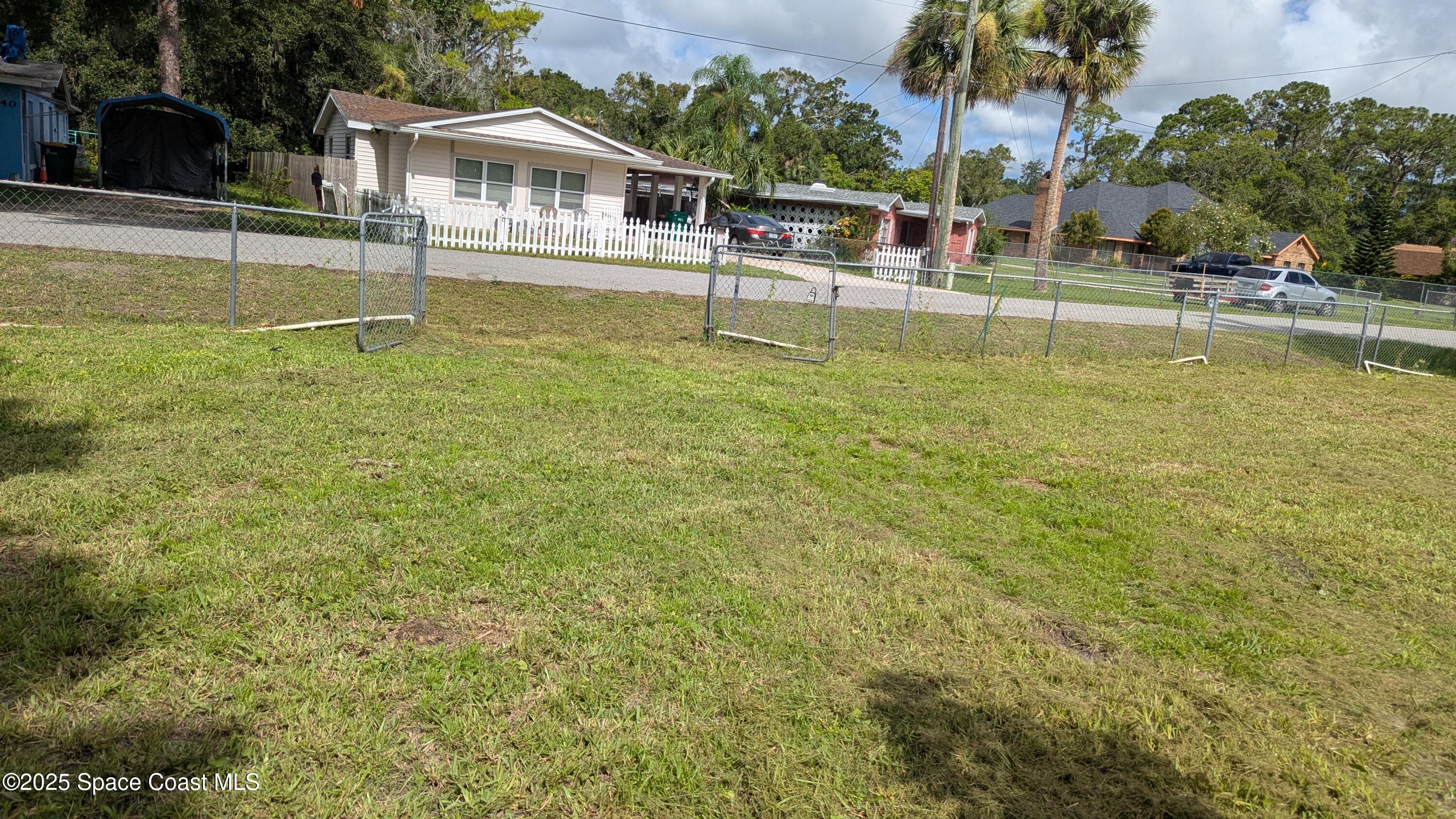 2235 Wood Street Melbourne, FL 32904 - Photo 2 of 4 a house view with swimming pool in front of it
