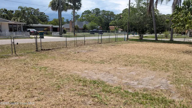 a backyard of a house with lots of green space