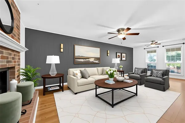 a living room with furniture potted plant and a window