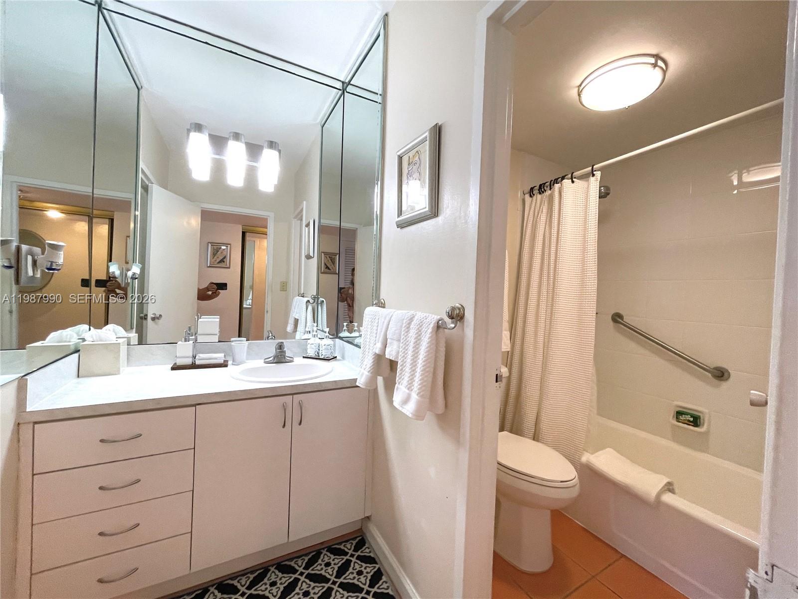 100 Lincoln Road, Unit 836 Miami Beach, FL 33139 - Photo 5 of 47 Bathtub and shower, 836, has beach chairs, umbrella beach