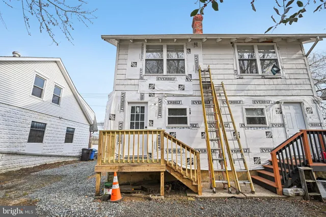 a view of a house with wooden stairs