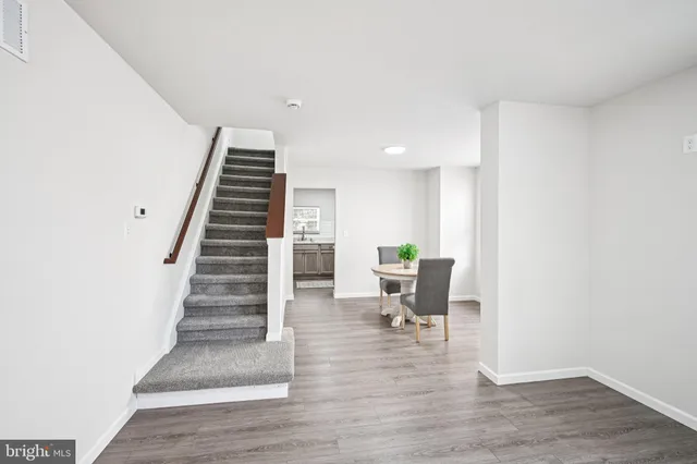 a view of entryway with wooden floor