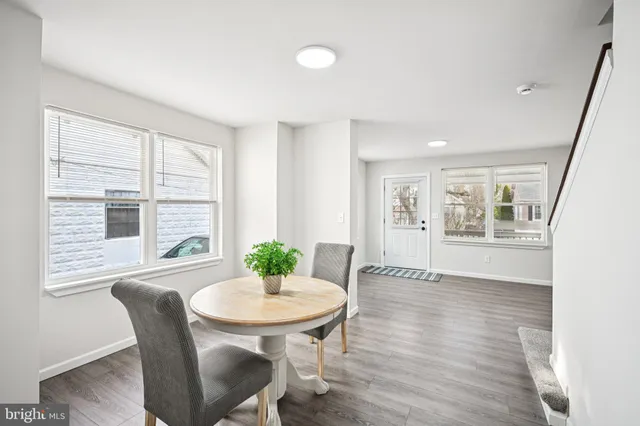 a view of a livingroom with furniture window and wooden floor