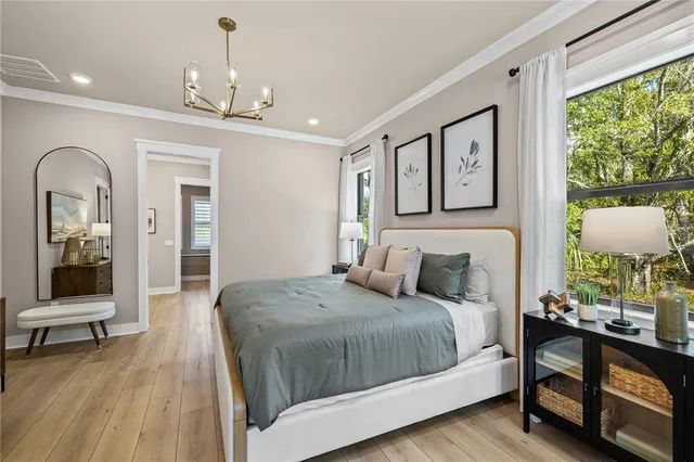 a bathroom with a toilet sink vanity and mirror