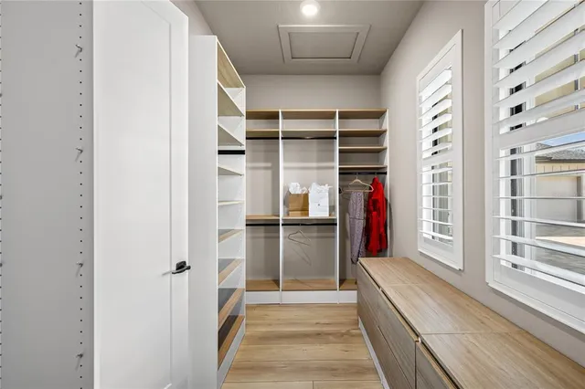 a bedroom with a large bed and a dresser