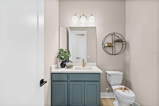 a living room with furniture a flat screen tv and a window