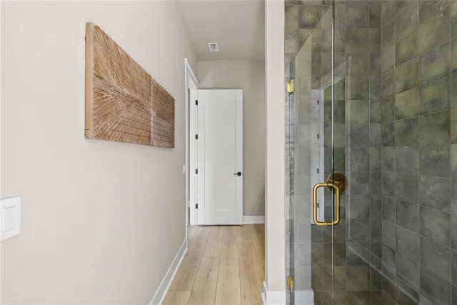 a view of a porch with furniture and garden