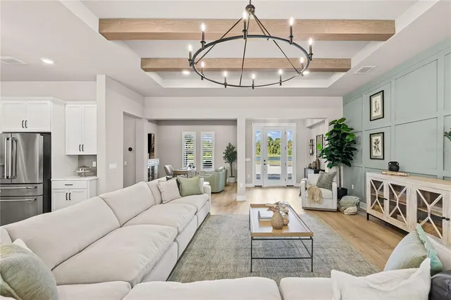 a dinning room and kitchen with a table chairs