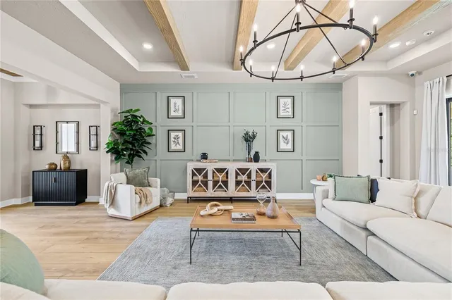 a kitchen with stainless steel appliances granite countertop a kitchen island a stove a table and chairs in it