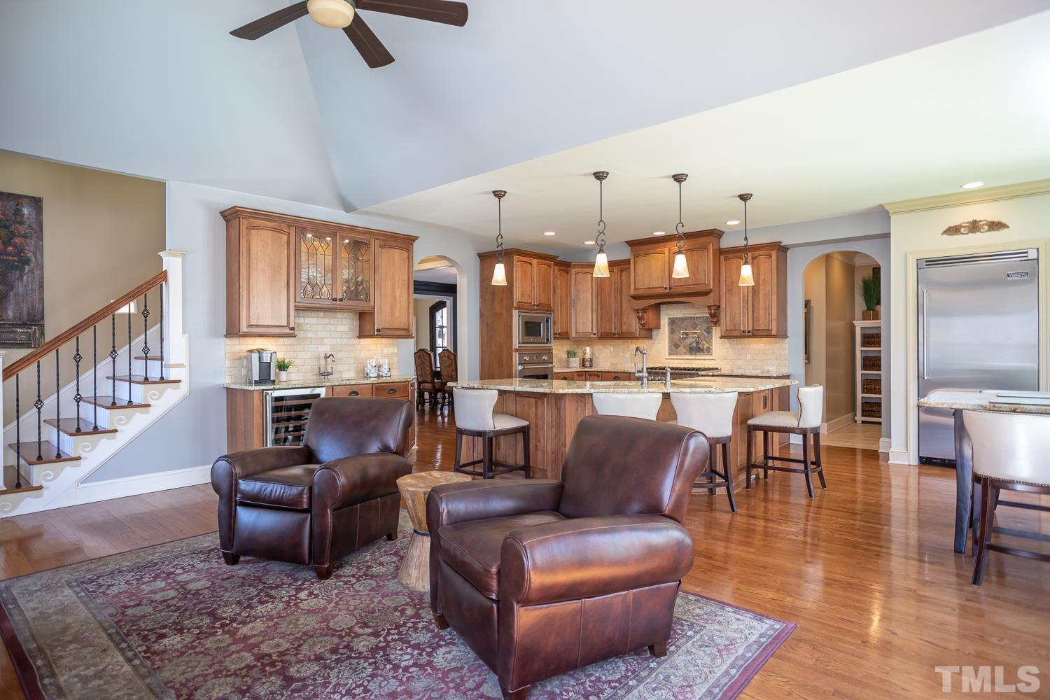 1616 Morning Mountain Road Raleigh, NC 27614 - Photo 18 of 86 a living room with furniture kitchen view and a chandelier