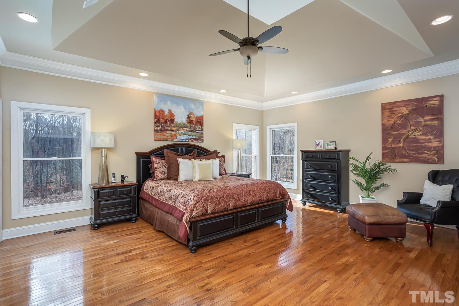 1616 Morning Mountain Road Raleigh, NC 27614 - Photo 22 of 86 a spacious bedroom with a bed window and a table