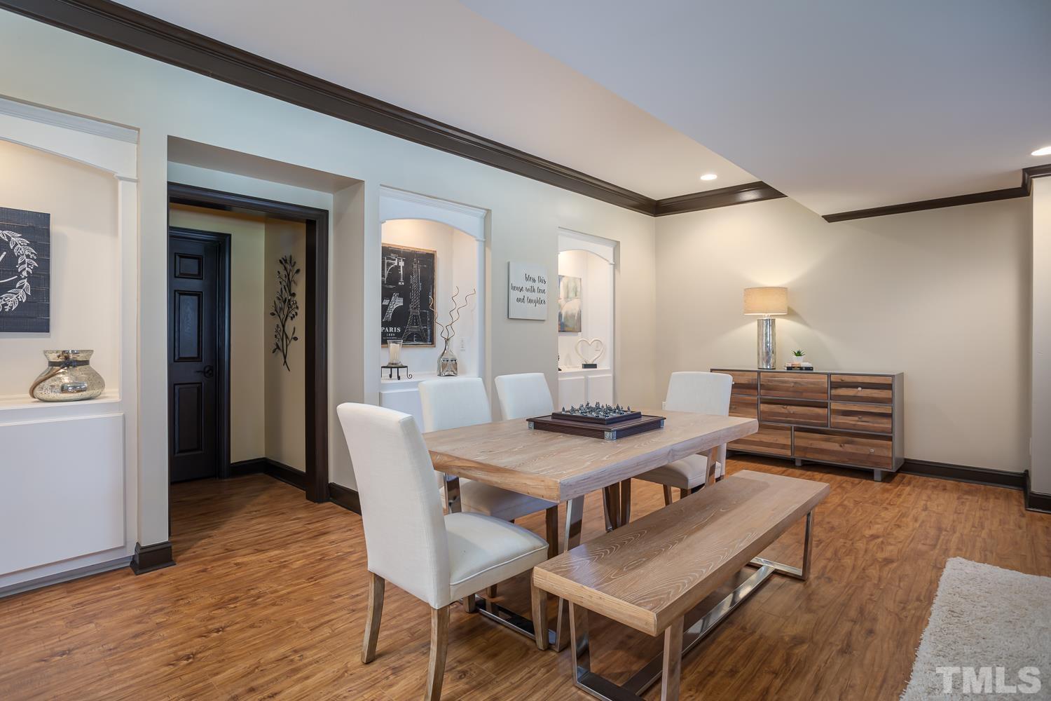 1616 Morning Mountain Road Raleigh, NC 27614 - Photo 47 of 86 a view of a dining room with furniture and wooden floor