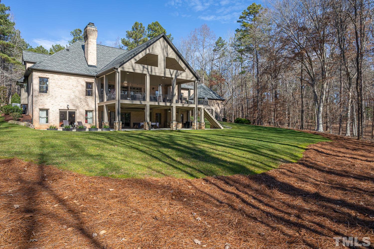 1616 Morning Mountain Road Raleigh, NC 27614 - Photo 64 of 86 a view of a big house with a big yard and potted plants