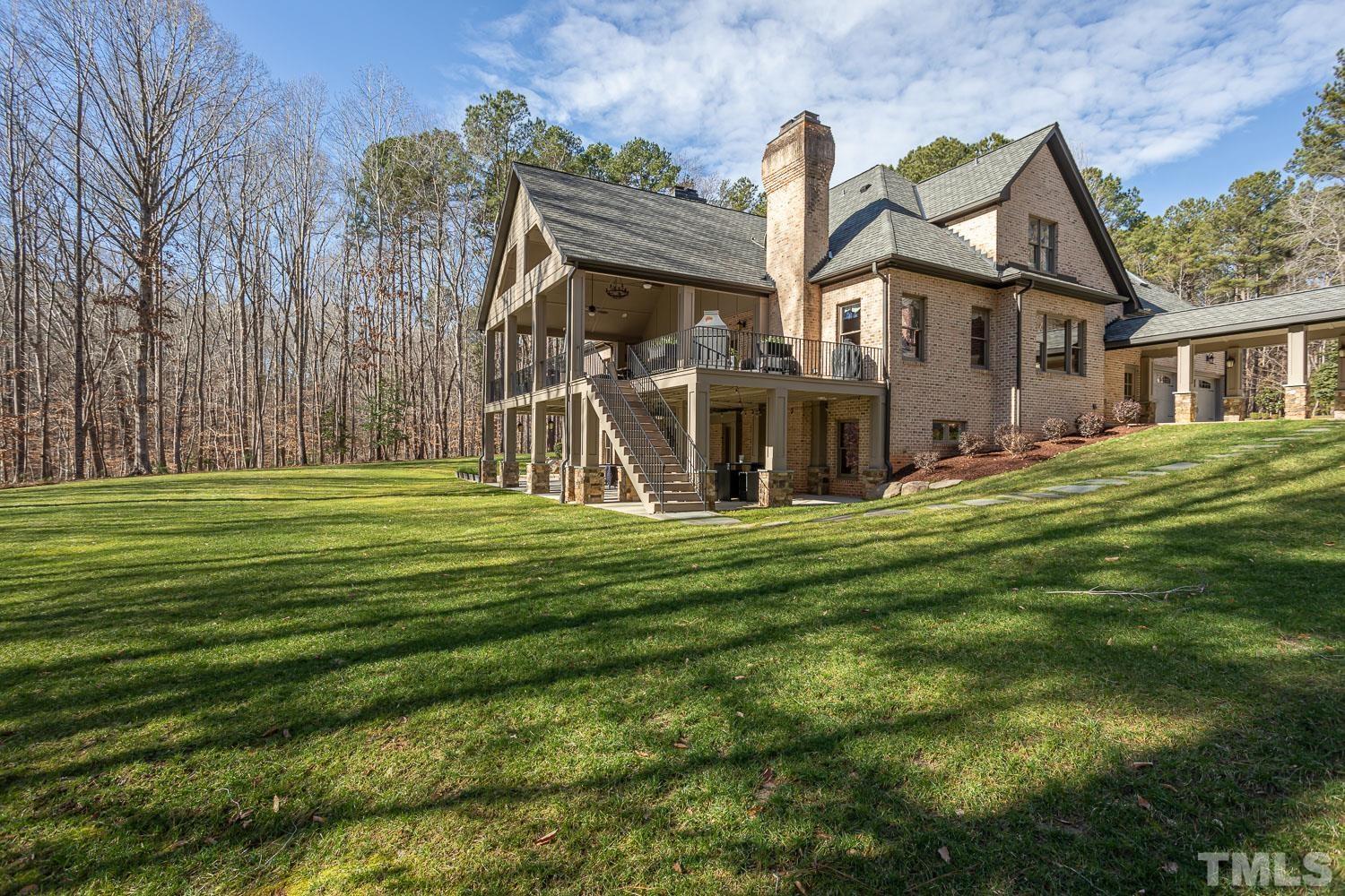 1616 Morning Mountain Road Raleigh, NC 27614 - Photo 65 of 86 a front view of a house with a garden
