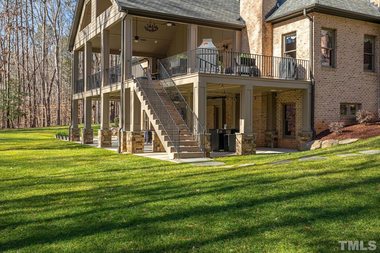 1616 Morning Mountain Road Raleigh, NC 27614 - Photo 66 of 86 a view of a big building with a big yard and large trees