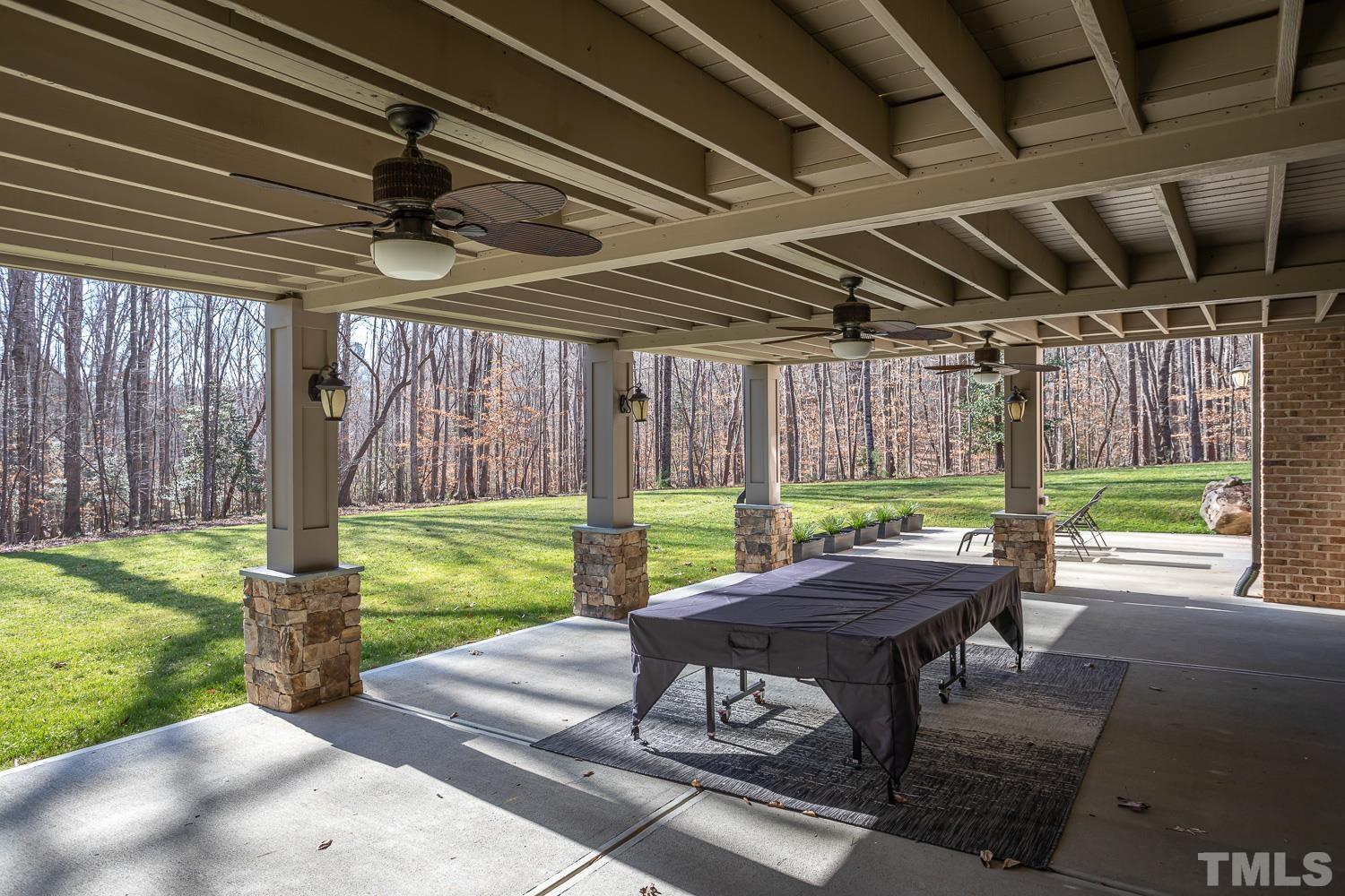 1616 Morning Mountain Road Raleigh, NC 27614 - Photo 68 of 86 a backyard of a house with garden table and chairs