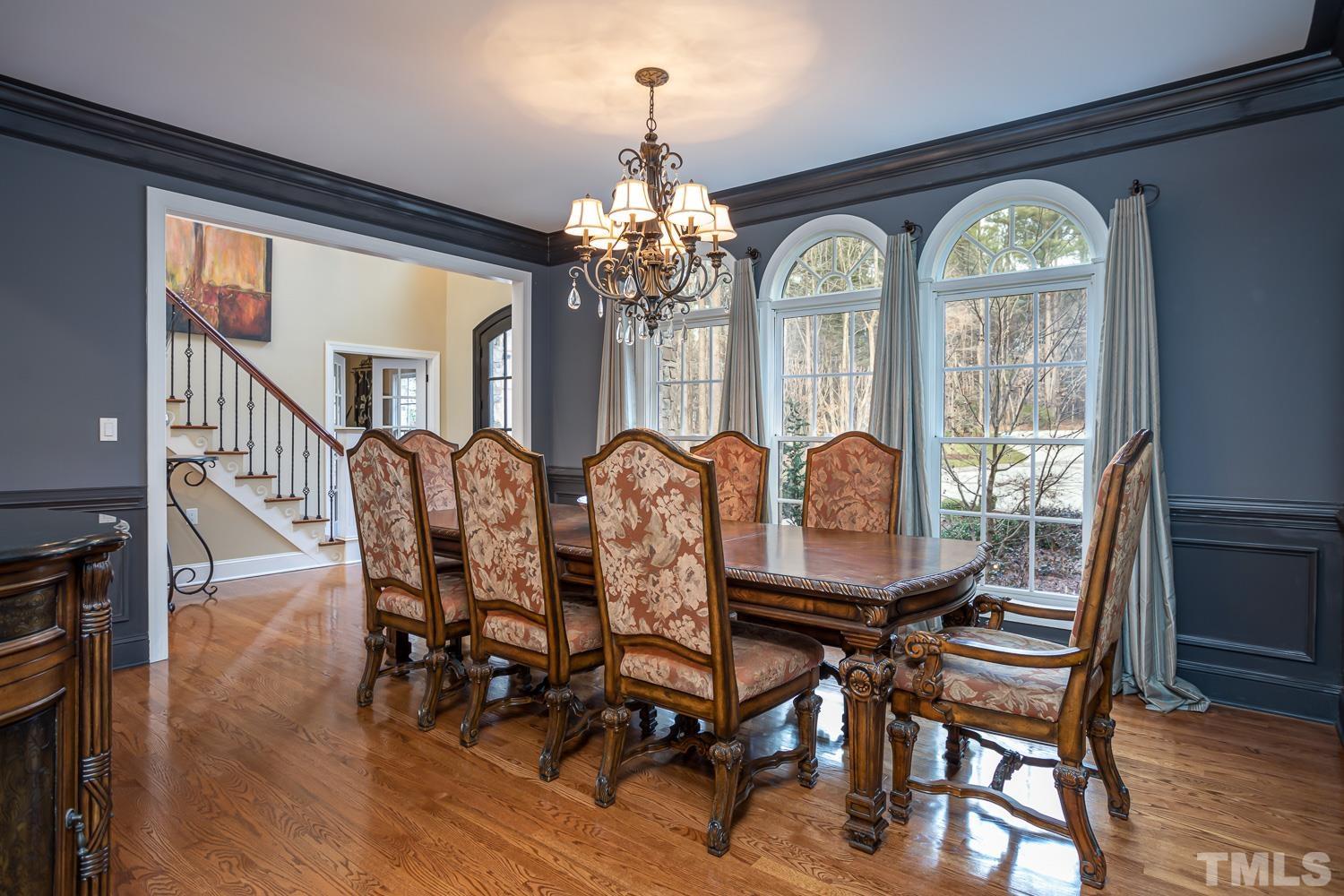 1616 Morning Mountain Road Raleigh, NC 27614 - Photo 9 of 86 a view of a dining room with furniture window and wooden floor