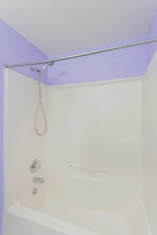 a kitchen that has a sink and a refrigerator