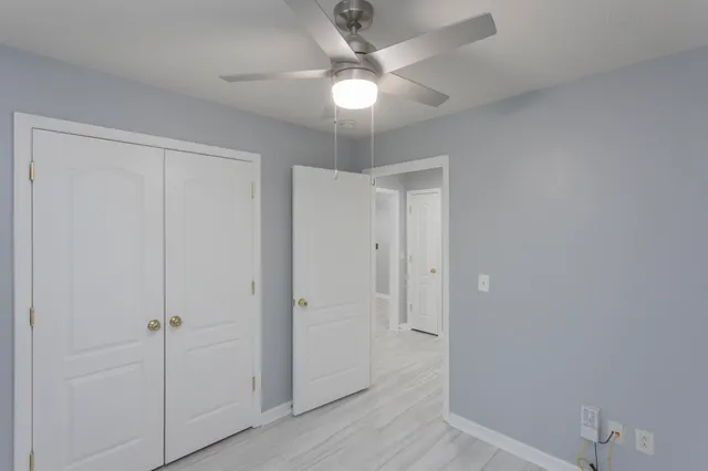 wooden floor in a hall with an empty room